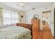 This bedroom has hardwood floors and a large window at 4211 28Th N Ave, St Petersburg, FL 33713