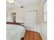 Bedroom with original wood floors, closet, and a large window at 4211 28Th N Ave, St Petersburg, FL 33713
