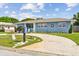 Well-maintained home with a circular driveway and attractive landscaping at 4211 28Th N Ave, St Petersburg, FL 33713