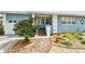 Charming home with lush landscaping and a brick walkway to the porch at 4211 28Th N Ave, St Petersburg, FL 33713