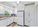 Functional kitchen with white appliances, ample storage, and a clean aesthetic at 4211 28Th N Ave, St Petersburg, FL 33713