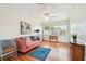 Bright living room with hardwood floors, comfortable seating, and a sunny window at 4211 28Th N Ave, St Petersburg, FL 33713