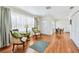 Open-concept living space with hardwood floors and lots of natural light at 4211 28Th N Ave, St Petersburg, FL 33713