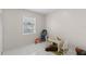 Cozy bedroom/playroom with tile floors and natural light at 4414 W Hanna Ave, Tampa, FL 33614