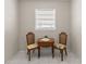 Cozy dining area featuring tile flooring and natural light from the window at 4414 W Hanna Ave, Tampa, FL 33614