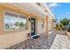 Charming front porch area with decorative tile flooring and welcoming entrance at 4414 W Hanna Ave, Tampa, FL 33614