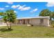 Charming single-story home with a well-maintained lawn and landscaping at 4414 W Hanna Ave, Tampa, FL 33614