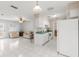 Open-concept floorplan integrating the kitchen, living area and dining space at 4414 W Hanna Ave, Tampa, FL 33614