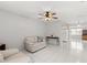 Cozy living area with tile floors and open layout to the kitchen at 4414 W Hanna Ave, Tampa, FL 33614