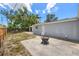 View of the backyard showing a fire pit on a concrete patio area at 4870 47Th N Ave, St Petersburg, FL 33714