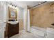 Cozy bathroom with tiled shower-tub combination, vanity, and framed mirror at 4870 47Th N Ave, St Petersburg, FL 33714