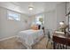 Bedroom with neutral colors, carpet, and a desk for a workspace at 4870 47Th N Ave, St Petersburg, FL 33714
