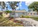 Exterior shot of the house showcasing curb appeal with landscaping and a tidy front entrance at 4870 47Th N Ave, St Petersburg, FL 33714