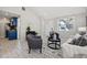 Inviting living area features tile floors, contemporary decor, and a view into the adjacent blue kitchen at 4870 47Th N Ave, St Petersburg, FL 33714