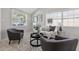 Comfortable living room featuring a stylish rug, soft seating, and calming decor in a bright, airy space at 4870 47Th N Ave, St Petersburg, FL 33714