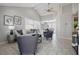 Bright living room with neutral paint, tile floors, vaulted ceiling, stylish decor, and access to the dining area at 4870 47Th N Ave, St Petersburg, FL 33714