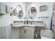 Elegant bathroom featuring stylish mirrors and a vanity with a corner sink at 505 67Th Ave # 11, St Pete Beach, FL 33706