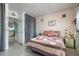 Comfortable bedroom with patterned bedspread and view of the kitchen through the doorway at 505 67Th Ave # 11, St Pete Beach, FL 33706