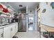 View of the kitchen that also leads to a hallway and bedroom at 505 67Th Ave # 11, St Pete Beach, FL 33706