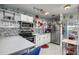 Bright kitchen with stainless steel appliances and a view into an adjacent bedroom at 505 67Th Ave # 11, St Pete Beach, FL 33706