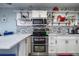 Well-equipped kitchen showcasing stainless steel double oven and tile backsplash at 505 67Th Ave # 11, St Pete Beach, FL 33706