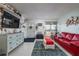 Charming living room featuring a comfortable seating area, stylish decor, and plenty of natural light at 505 67Th Ave # 11, St Pete Beach, FL 33706