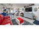 Spacious living area showcasing stylish decor, a TV, and seamless flow to the kitchen at 505 67Th Ave # 11, St Pete Beach, FL 33706
