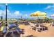 Outdoor seating area with picnic tables and view of the beach; a perfect spot for relaxing and enjoying the scenery at 505 67Th Ave # 11, St Pete Beach, FL 33706
