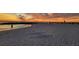 Stunning sunset view over the beach and ocean, silhouettes of people in the distance at 505 67Th Ave # 11, St Pete Beach, FL 33706