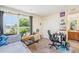 Bright bedroom featuring a large window and comfortable furnishings at 5501 67Th N Ave # 11, Pinellas Park, FL 33781