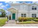 Charming townhome featuring a welcoming green front door and neat landscaping at 5501 67Th N Ave # 11, Pinellas Park, FL 33781