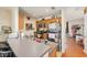 Practical kitchen layout with stainless steel fridge and open access to other rooms at 5501 67Th N Ave # 11, Pinellas Park, FL 33781