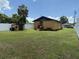 Exterior shot of home with lawn and storage shed at 5807 N Hale Ave, Tampa, FL 33614