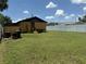 Spacious backyard with exterior of home at 5807 N Hale Ave, Tampa, FL 33614