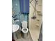 Compact bathroom with a walk-in shower, toilet, and sink at 5807 N Hale Ave, Tampa, FL 33614