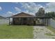 Charming single-story home featuring a covered porch, carport, and a compact front yard at 5807 N Hale Ave, Tampa, FL 33614