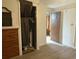 Hallway with wood-look vinyl floors leading to closet, bedroom, and adjoining room at 5807 N Hale Ave, Tampa, FL 33614