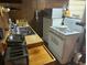 Functional kitchen featuring a stainless steel sink, ample counter space, and basic appliances at 5807 N Hale Ave, Tampa, FL 33614