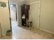 Interior shot of a room with shelving, neutral paint, and a view into another room at 5807 N Hale Ave, Tampa, FL 33614