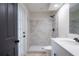 Elegant bathroom featuring a walk-in shower, tiled walls and a modern vanity, ensuring a harmonious blend of style and comfort at 6123 India Dr, Spring Hill, FL 34608