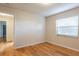 Inviting bedroom with hardwood floors and natural light, ensuring a comfortable and serene ambiance for rest and relaxation at 6123 India Dr, Spring Hill, FL 34608