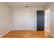 Bedroom showcasing hardwood floors and closet space, offering ample storage while maintaining an elegant and functional layout at 6123 India Dr, Spring Hill, FL 34608