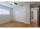 Comfortable bedroom featuring hardwood floors and a closet, offering ample storage and enhancing the room's functionality at 6123 India Dr, Spring Hill, FL 34608