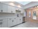 Beautiful kitchen with white cabinets, stainless steel appliances, and plenty of natural light at 6123 India Dr, Spring Hill, FL 34608