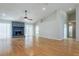 Spacious living room with vaulted ceilings, hardwood floors and a stone fireplace at 6123 India Dr, Spring Hill, FL 34608