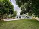 Spacious backyard features a well-maintained lawn, a fence and a pool area perfect for outdoor enjoyment at 6332 Emerson S Ave, St Petersburg, FL 33707