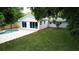 An inviting backyard with a sparkling pool, spacious patio, and freshly manicured lawn at 6332 Emerson S Ave, St Petersburg, FL 33707
