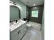 Elegant bathroom showcasing a shower-tub combo, modern fixtures, and sleek design elements at 6332 Emerson S Ave, St Petersburg, FL 33707