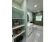Bathroom showcasing modern fixtures, a tiled shower/tub, and open shelving for optimal storage space at 6332 Emerson S Ave, St Petersburg, FL 33707