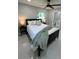 Comfortable bedroom with a queen bed, stylish bedside tables, and a view into the en-suite bathroom at 6332 Emerson S Ave, St Petersburg, FL 33707